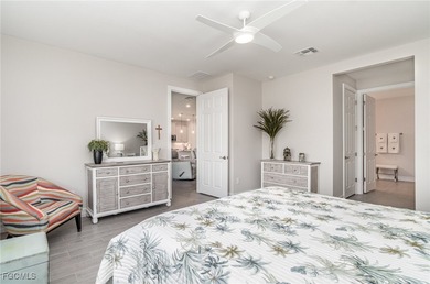 This Delray model from the Traditional Series features a tile on Herons Glen Golf and Country Club in Florida - for sale on GolfHomes.com, golf home, golf lot