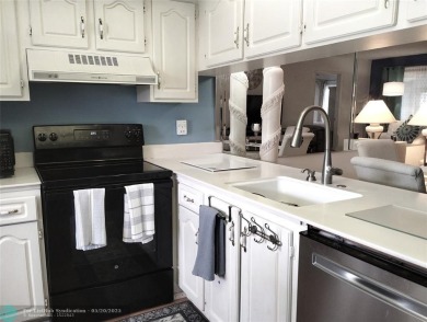 LOVELY 2ND STORY, CORNER 2BR/2BTH CONDO IN THE PEACEFUL BAHAMA on Wynmoor Golf Course in Florida - for sale on GolfHomes.com, golf home, golf lot