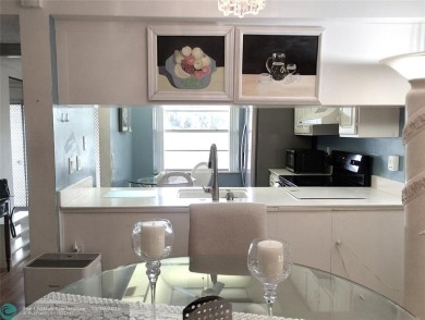 LOVELY 2ND STORY, CORNER 2BR/2BTH CONDO IN THE PEACEFUL BAHAMA on Wynmoor Golf Course in Florida - for sale on GolfHomes.com, golf home, golf lot
