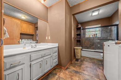 Nestled in a peaceful, wooded setting of Diamondhead Golf & on Diamondhead Golf and Country Club in Arkansas - for sale on GolfHomes.com, golf home, golf lot