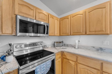 Are you looking for a cozy 2 bedroom home tucked away on a golf on Las Colinas Golf Club in Arizona - for sale on GolfHomes.com, golf home, golf lot
