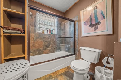 Nestled in a peaceful, wooded setting of Diamondhead Golf & on Diamondhead Golf and Country Club in Arkansas - for sale on GolfHomes.com, golf home, golf lot