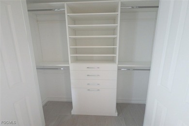 Featuring a TILE ROOF, ELEGANT STONE VENEER, IMPACT RESISTANT on Herons Glen Golf and Country Club in Florida - for sale on GolfHomes.com, golf home, golf lot