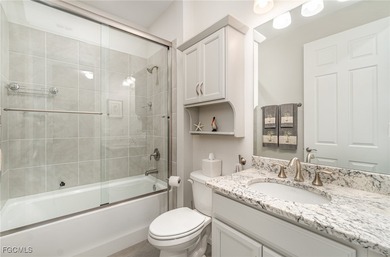 Featuring a TILE ROOF, ELEGANT STONE VENEER, IMPACT RESISTANT on Herons Glen Golf and Country Club in Florida - for sale on GolfHomes.com, golf home, golf lot