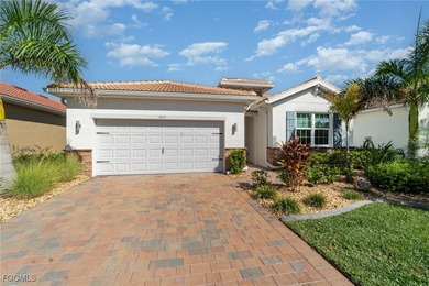 Featuring a TILE ROOF, ELEGANT STONE VENEER, IMPACT RESISTANT on Herons Glen Golf and Country Club in Florida - for sale on GolfHomes.com, golf home, golf lot