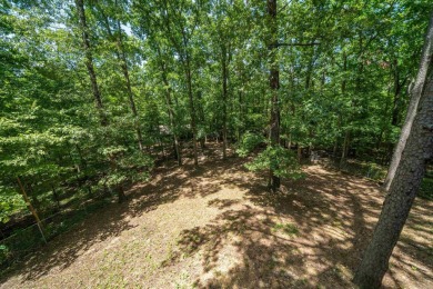 Nestled in a peaceful, wooded setting of Diamondhead Golf & on Diamondhead Golf and Country Club in Arkansas - for sale on GolfHomes.com, golf home, golf lot