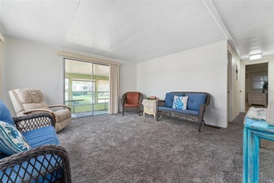 MOVE-IN READY! 2 BED/2 BATH COZY RETREAT - TWO FLORIDA ROOMS - on Bay Tree Golf Course in Florida - for sale on GolfHomes.com, golf home, golf lot