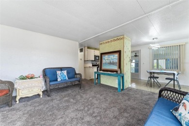 MOVE-IN READY! 2 BED/2 BATH COZY RETREAT - TWO FLORIDA ROOMS - on Bay Tree Golf Course in Florida - for sale on GolfHomes.com, golf home, golf lot
