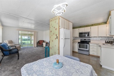 MOVE-IN READY! 2 BED/2 BATH COZY RETREAT - TWO FLORIDA ROOMS - on Bay Tree Golf Course in Florida - for sale on GolfHomes.com, golf home, golf lot
