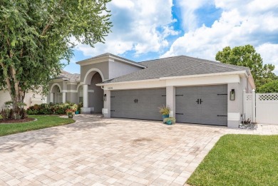Experience refined Florida living at its finest in this on The Eagles Golf Course and Club in Florida - for sale on GolfHomes.com, golf home, golf lot