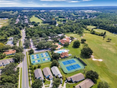 Imagine enjoying a cup of coffee on your back patio, looking out on Country Club of Mount Dora in Florida - for sale on GolfHomes.com, golf home, golf lot