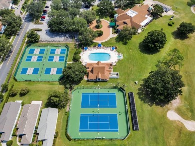 Imagine enjoying a cup of coffee on your back patio, looking out on Country Club of Mount Dora in Florida - for sale on GolfHomes.com, golf home, golf lot