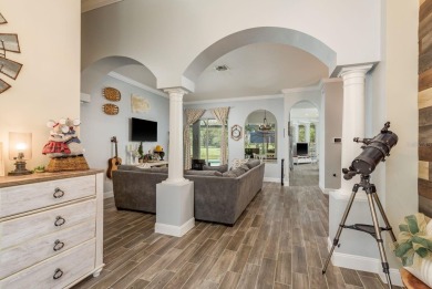 Experience refined Florida living at its finest in this on The Eagles Golf Course and Club in Florida - for sale on GolfHomes.com, golf home, golf lot