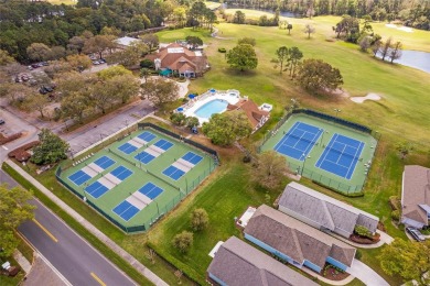 Imagine enjoying a cup of coffee on your back patio, looking out on Country Club of Mount Dora in Florida - for sale on GolfHomes.com, golf home, golf lot