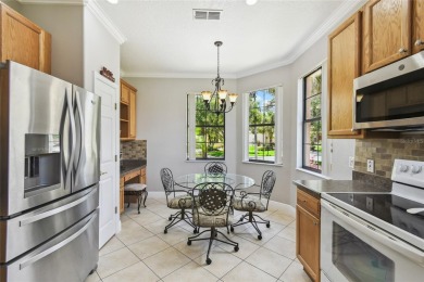 Stunning 2-bedroom, 2-bath plus DEN Hemingway model with on Poinciana Golf Club in Florida - for sale on GolfHomes.com, golf home, golf lot