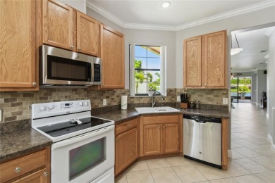 Stunning 2-bedroom, 2-bath plus DEN Hemingway model with on Poinciana Golf Club in Florida - for sale on GolfHomes.com, golf home, golf lot