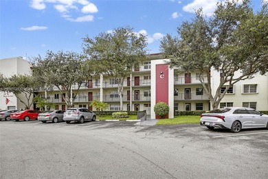 Enjoy serene lake and golf course views from this first-floor on Flamingo Lakes Country Club in Florida - for sale on GolfHomes.com, golf home, golf lot
