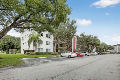 Enjoy serene lake and golf course views from this first-floor on Flamingo Lakes Country Club in Florida - for sale on GolfHomes.com, golf home, golf lot