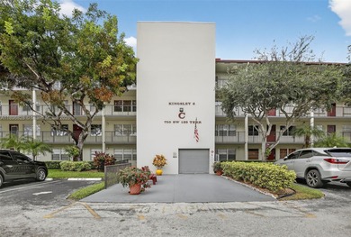 Enjoy serene lake and golf course views from this first-floor on Flamingo Lakes Country Club in Florida - for sale on GolfHomes.com, golf home, golf lot