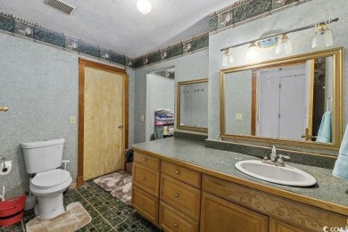Discover the potential of this 3-bedroom, 2-bath home perfectly on Sea Trail Golf Resort in North Carolina - for sale on GolfHomes.com, golf home, golf lot
