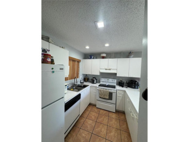 Townhouse Style Condo in Paseo Real Community in Kendall, this on Miccosukee Golf and Country Club in Florida - for sale on GolfHomes.com, golf home, golf lot