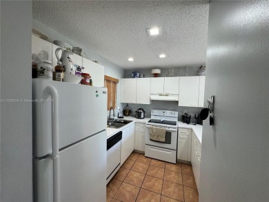 Townhouse Style Condo in Paseo Real Community in Kendall, this on Miccosukee Golf and Country Club in Florida - for sale on GolfHomes.com, golf home, golf lot