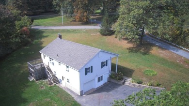 This split level home has fantastic curb appeal & is surrounded on Blackstone National Golf Course in Massachusetts - for sale on GolfHomes.com, golf home, golf lot