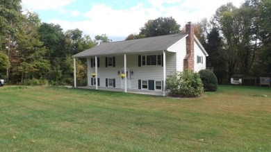 This split level home has fantastic curb appeal & is surrounded on Blackstone National Golf Course in Massachusetts - for sale on GolfHomes.com, golf home, golf lot