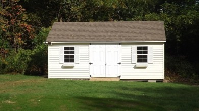 This split level home has fantastic curb appeal & is surrounded on Blackstone National Golf Course in Massachusetts - for sale on GolfHomes.com, golf home, golf lot