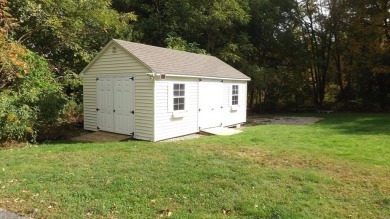 This split level home has fantastic curb appeal & is surrounded on Blackstone National Golf Course in Massachusetts - for sale on GolfHomes.com, golf home, golf lot