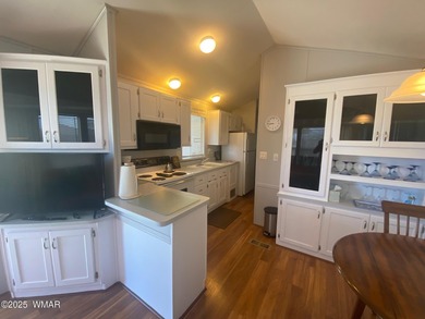 This cozy, bright park model home features a huge covered deck on Juniper Ridge R.V. Golf Resort in Arizona - for sale on GolfHomes.com, golf home, golf lot