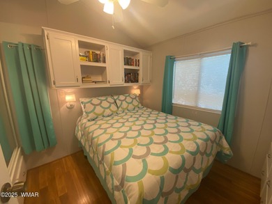 This cozy, bright park model home features a huge covered deck on Juniper Ridge R.V. Golf Resort in Arizona - for sale on GolfHomes.com, golf home, golf lot