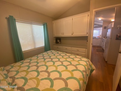 This cozy, bright park model home features a huge covered deck on Juniper Ridge R.V. Golf Resort in Arizona - for sale on GolfHomes.com, golf home, golf lot