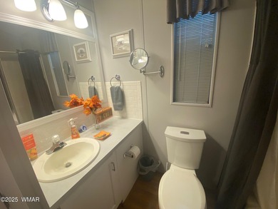 This cozy, bright park model home features a huge covered deck on Juniper Ridge R.V. Golf Resort in Arizona - for sale on GolfHomes.com, golf home, golf lot