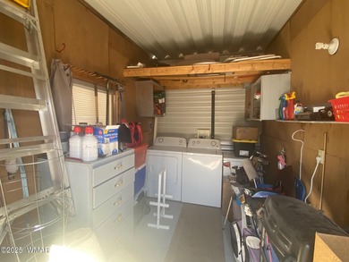 This cozy, bright park model home features a huge covered deck on Juniper Ridge R.V. Golf Resort in Arizona - for sale on GolfHomes.com, golf home, golf lot