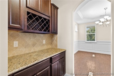 Welcome home to this beautifully maintained 6 bedroom, 3.5 bath on Kings Grant Golf and Country Club in North Carolina - for sale on GolfHomes.com, golf home, golf lot