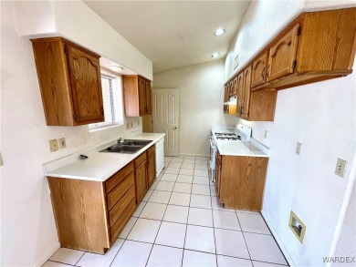 Don't miss out on this great 3 Bedroom 2 Bath home in the center on Cerbat Cliffs Golf Course in Arizona - for sale on GolfHomes.com, golf home, golf lot