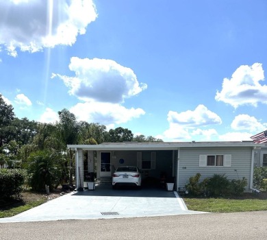 Spacious Corner Lot Gem: Furnished 2-Bedroom Palm Harbor Home on Schalamar Creek Golf and Country Club in Florida - for sale on GolfHomes.com, golf home, golf lot
