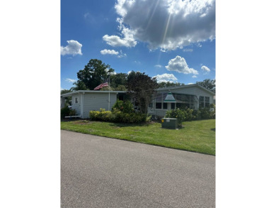 Spacious Corner Lot Gem: Furnished 2-Bedroom Palm Harbor Home on Schalamar Creek Golf and Country Club in Florida - for sale on GolfHomes.com, golf home, golf lot
