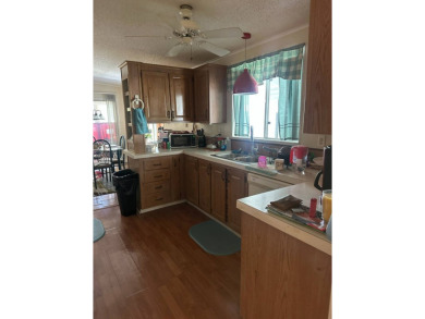 Spacious Corner Lot Gem: Furnished 2-Bedroom Palm Harbor Home on Schalamar Creek Golf and Country Club in Florida - for sale on GolfHomes.com, golf home, golf lot