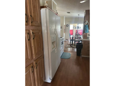 Spacious Corner Lot Gem: Furnished 2-Bedroom Palm Harbor Home on Schalamar Creek Golf and Country Club in Florida - for sale on GolfHomes.com, golf home, golf lot