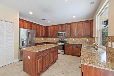 Nestled in a cul-de-sac in the sought-after community of Egret on The Golf Club of Jupiter in Florida - for sale on GolfHomes.com, golf home, golf lot