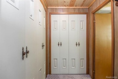 Welcome to your Up North getaway or your year round home inside on Lost Lake Woods Club in Michigan - for sale on GolfHomes.com, golf home, golf lot