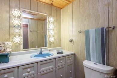 Welcome to your Up North getaway or your year round home inside on Lost Lake Woods Club in Michigan - for sale on GolfHomes.com, golf home, golf lot