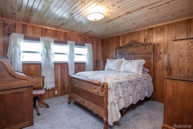 Welcome to your Up North getaway or your year round home inside on Lost Lake Woods Club in Michigan - for sale on GolfHomes.com, golf home, golf lot