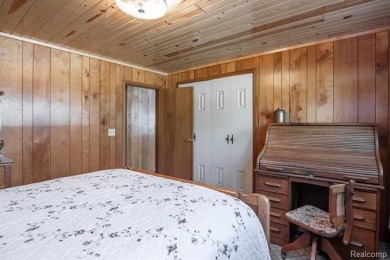 Welcome to your Up North getaway or your year round home inside on Lost Lake Woods Club in Michigan - for sale on GolfHomes.com, golf home, golf lot