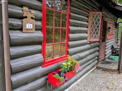 This impeccably maintained, climate-controlled, historic Log on Lucerne In Maine Golf Course in Maine - for sale on GolfHomes.com, golf home, golf lot