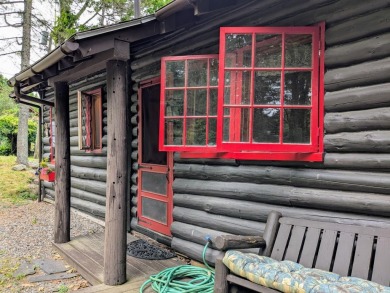 This impeccably maintained, climate-controlled, historic Log on Lucerne In Maine Golf Course in Maine - for sale on GolfHomes.com, golf home, golf lot