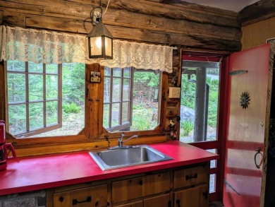 This impeccably maintained, climate-controlled, historic Log on Lucerne In Maine Golf Course in Maine - for sale on GolfHomes.com, golf home, golf lot