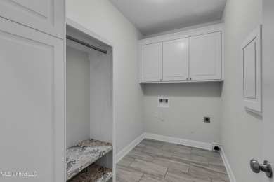 Do not miss this Beautiful white brick home with wonderful on Lake Caroline Golf Club in Mississippi - for sale on GolfHomes.com, golf home, golf lot